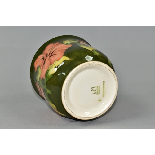 378 - A MOORCROFT POTTERY PLANTER, in the Coral Hibiscus pattern on a green ground, height 12.5cm x intern... 