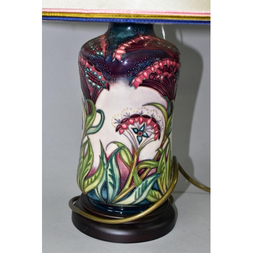 392 - A MOORCROFT POTTERY 'GYPSY' PATTERN TABLE LAMP, of waisted cylindrical form, tube lined with intrica... 