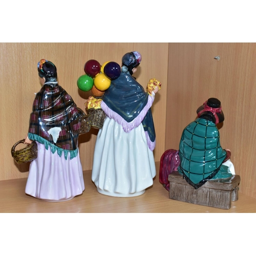 393 - THREE ROYAL DOULTON FIGURINES DEPICTING STREET SELLERS, comprising Silks and Ribbons HN2017, The Ora... 