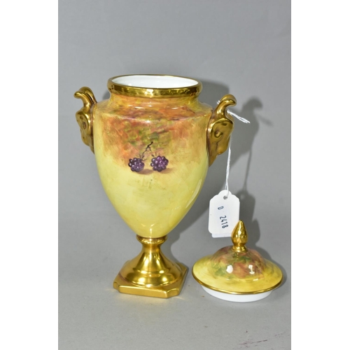 394 - A COALPORT PEDESTAL COVERED VASE, of urn form hand painted with fruit, signed N (Norman) Lear, gilt ... 