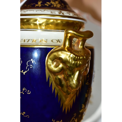 398 - A LIMITED EDITION COALPORT TWIN RAM'S HEAD HANDLED PEDESTAL COVERED VASE, commemorating the 25th ann... 