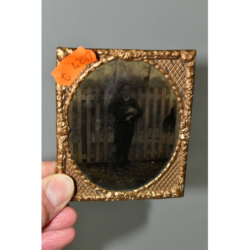 407 - THREE AMBROTYPES AND A TINTYPE PHOTOGRAPH, comprising a leather cased image of a seated gentleman, a... 