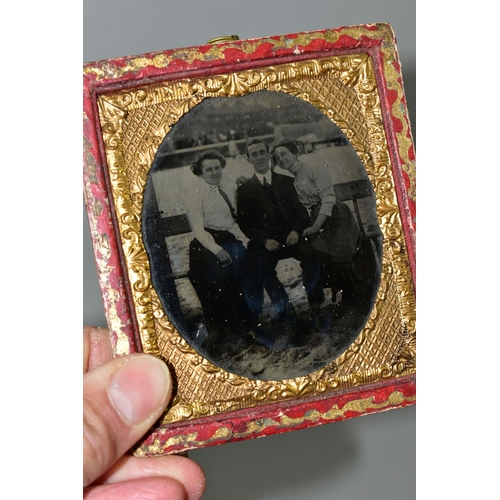 407 - THREE AMBROTYPES AND A TINTYPE PHOTOGRAPH, comprising a leather cased image of a seated gentleman, a... 