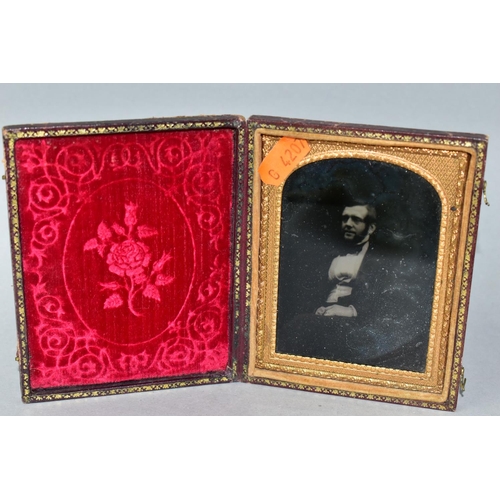 407 - THREE AMBROTYPES AND A TINTYPE PHOTOGRAPH, comprising a leather cased image of a seated gentleman, a... 