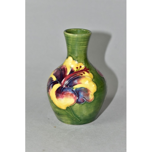 434 - A MOORCROFT POTTERY HIBISCUS PATTERN BUD VASE, of baluster form, with tube lined yellow, pink and pu... 