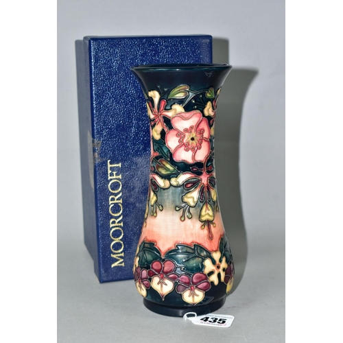 435 - A BOXED MOORCROFT POTTERY OBERON PATTERN VASE, of waisted form, with tube lined flowers and foliage ... 