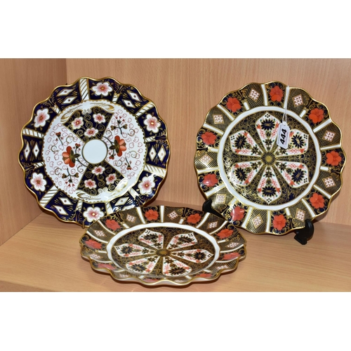 444 - A PAIR OF ROYAL CROWN DERBY OLD IMARI 1128 PLATES, WITH A TRADITIONAL IMARI 2451 PLATE, all having w... 