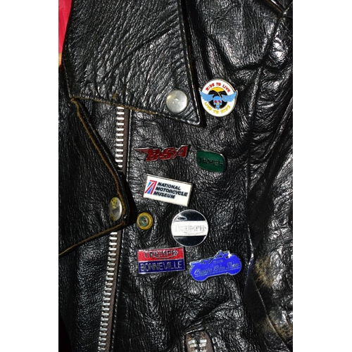 536 - A BLACK LEATHER PIN BADGE BIKER'S JACKET, size small, Frank N Furter style, with sixteen metal pin b... 