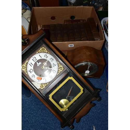 562 - A BOX AND LOOSE BOOKS AND CLOCKS, comprising a Lava 31 day wall clock, a twentieth century wooden ca... 