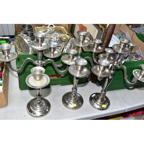 474 - ONE BOX OF METALWARE, to include three stainless steel five flame candelabra, height 39cm, two glass... 