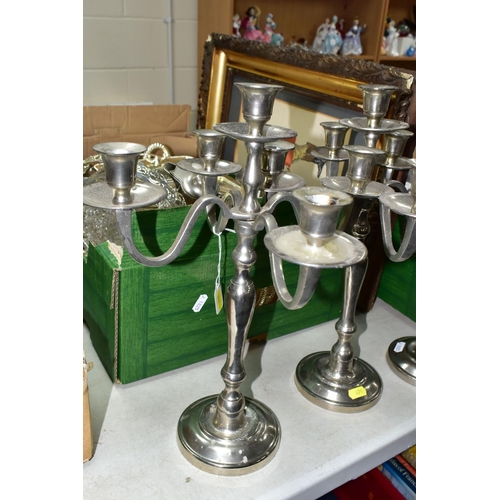 474 - ONE BOX OF METALWARE, to include three stainless steel five flame candelabra, height 39cm, two glass... 