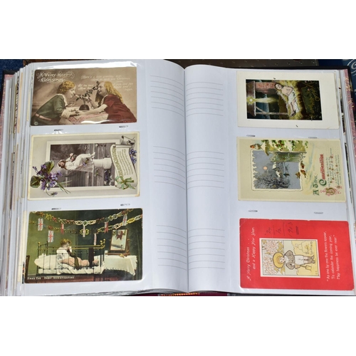 501 - POSTCARDS, four albums containing approximately 625 Sentimental Postcards dating from The Victorian ... 