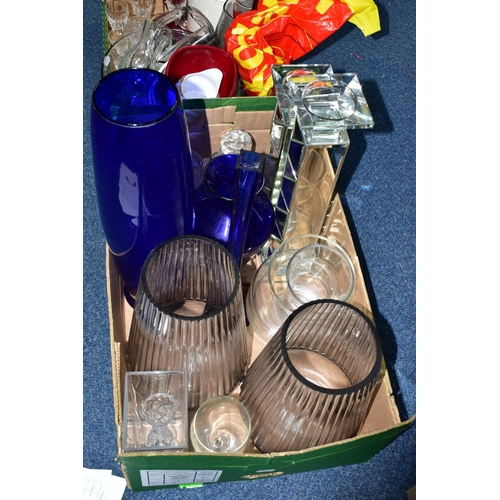 584 - TWO BOXES OF ASSORTED COLOURED GLASSWARE, to include an art glass red controlled bubble dish, a red ... 