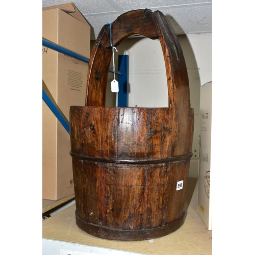 598 - AN IRON BANDED WOODEN PAIL, having a fixed handle, approximate height 59cm