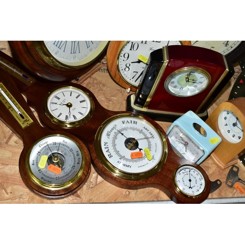 640 - A GROUP OF CLOCKS AND BAROMETERS, to include wall, mantel and alarm clocks, a Royal Air Force Spitfi... 