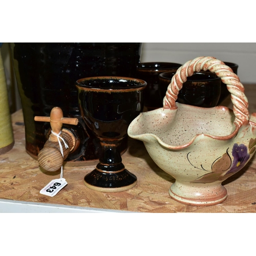 643 - A GROUP OF STUDIO POTTERY, to include a brown glazed cider flagon, height 44cm, with four matching g... 