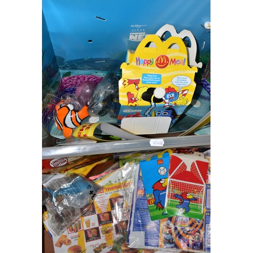 735 - FOUR BOXES OF MCDONALDS HAPPY MEAL TOYS AND ADVERTISING ITEMS, to include sealed packs, incomplete s... 