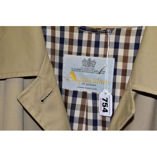 754 - A LADIES AQUASCUTUM CLASSIC RAINCOAT, with classic Aquascutum check lining, size 16 (1) (Condition r... 