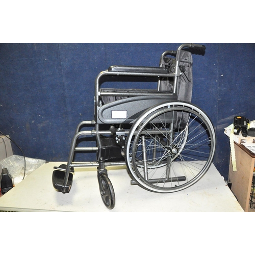 1059 - AN AIDAPT FOLDING WHEELCHAIR, with footrests