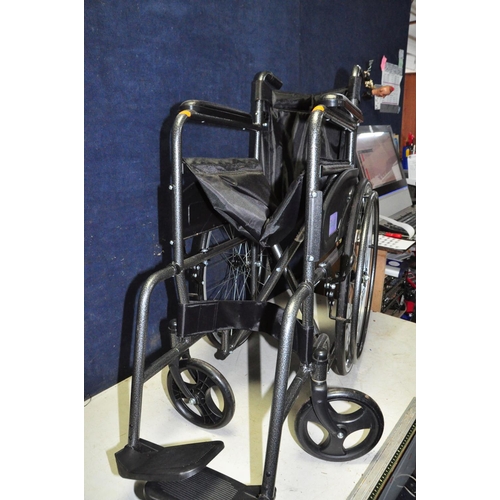 1059 - AN AIDAPT FOLDING WHEELCHAIR, with footrests