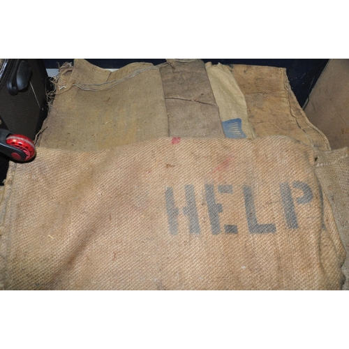 1069 - A SUITCASE CONTAINING A QUANTITY OF VINTAGE HESSIAN SACKS (14in all)