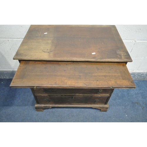 1204 - A 18TH CENTURY OAK BACHELORS CHEST OF FOUR GRADUATED DRAWERS, with a brushing slide, on bracket feet... 