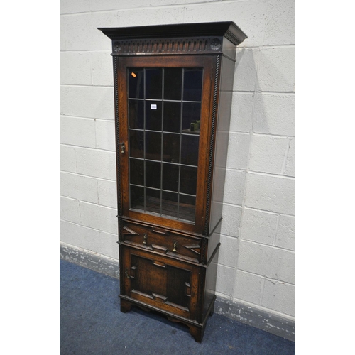 1208 - AN EARLY 20TH CENTURY OAK LEAD GLAZED SINGLE DOOR BOOKCASE, enclosing three adjustable shelves, abov... 