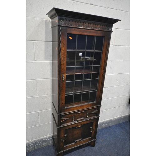 1208 - AN EARLY 20TH CENTURY OAK LEAD GLAZED SINGLE DOOR BOOKCASE, enclosing three adjustable shelves, abov... 