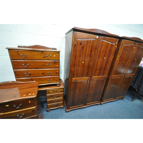 1211 - A STAINED PINE BEDROOM SUITE, comprising two double door wardrobes, width 104cm x depth 56cm x heigh... 