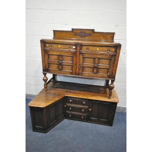 1213 - A 20TH CENTURY OAK SIDEBOARD, with a raised back, two drawers, and double cupboard doors, width 122c... 