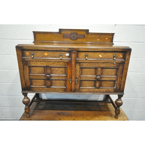 1213 - A 20TH CENTURY OAK SIDEBOARD, with a raised back, two drawers, and double cupboard doors, width 122c... 