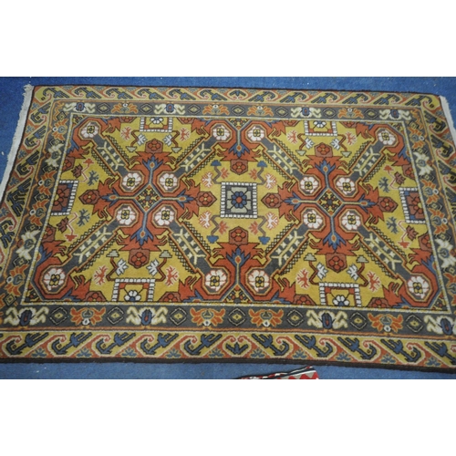 1314 - A MID 20TH CENTURY WOOLLEN EAGLE KAZAK RUG, with a russet field, 199cm x 128cm (condition:-tassels w... 