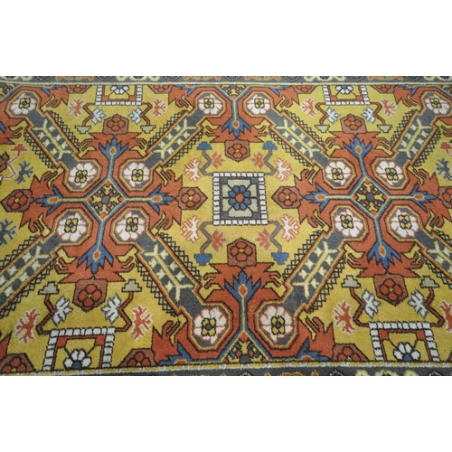 1314 - A MID 20TH CENTURY WOOLLEN EAGLE KAZAK RUG, with a russet field, 199cm x 128cm (condition:-tassels w... 