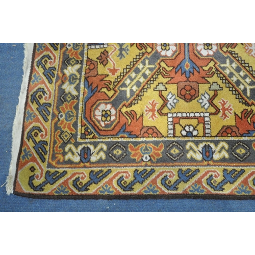 1314 - A MID 20TH CENTURY WOOLLEN EAGLE KAZAK RUG, with a russet field, 199cm x 128cm (condition:-tassels w... 