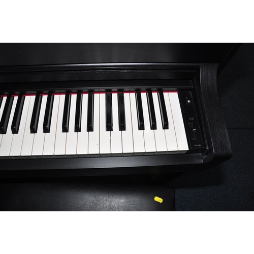 837 - A YAMAHA CLAVINOVA CLP545 DIGITAL ELECTRIC PIANO in matt black finish with manual, a matching black ... 