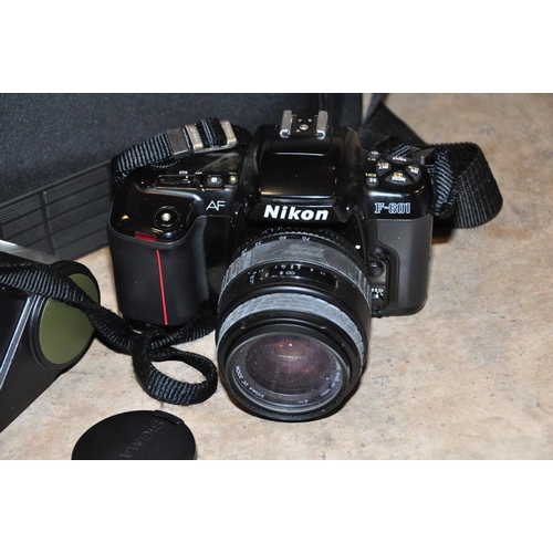 856 - A NIKON F-601 FILM SLR CAMERA fitted with a Sigma 28-70mm f3.5 lens with case, an Osram AF281 flash ... 