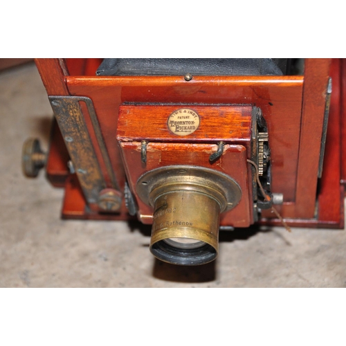 859 - A THORNTON PICKARD MAHOGANY FIELD CAMERA with brass adornments, a Bausch 8in a.g. Rathenow lens , pl... 