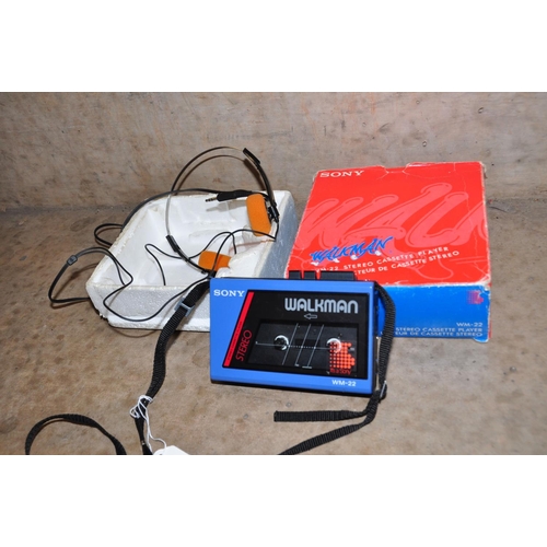 869 - A VINTAGE SONY WM-22 WALKMAN in blue and black with a pair of Min 2A headphones and original box ( i... 