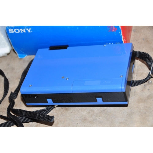 869 - A VINTAGE SONY WM-22 WALKMAN in blue and black with a pair of Min 2A headphones and original box ( i... 