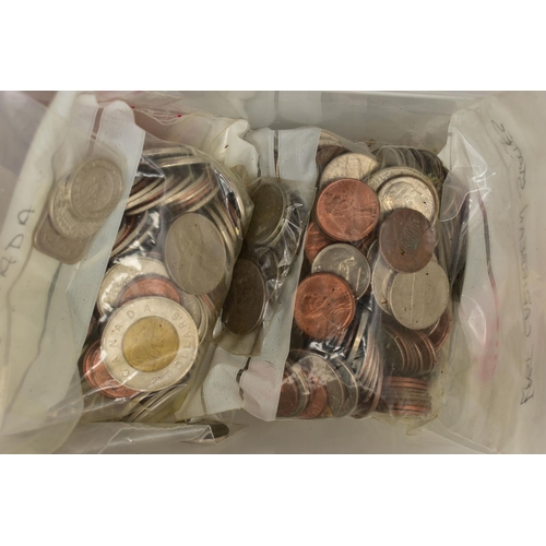 128 - A LARGE AND HEAVY PLASTIC BOX OF WORLD COINS, to include low value coinage from most of the European... 