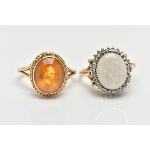 13 - TWO 9CT YELLOW GOLD GEM SET RINGS, to include an opal and diamond cluster ring, the oval opal caboch... 