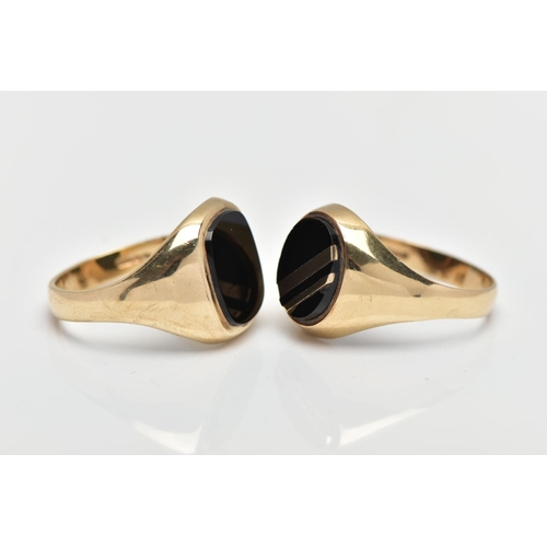 16 - TWO 9CT YELLOW GOLD ONYX SIGNET RINGS, the first set with an oval onyx panel with yellow metal inlay... 