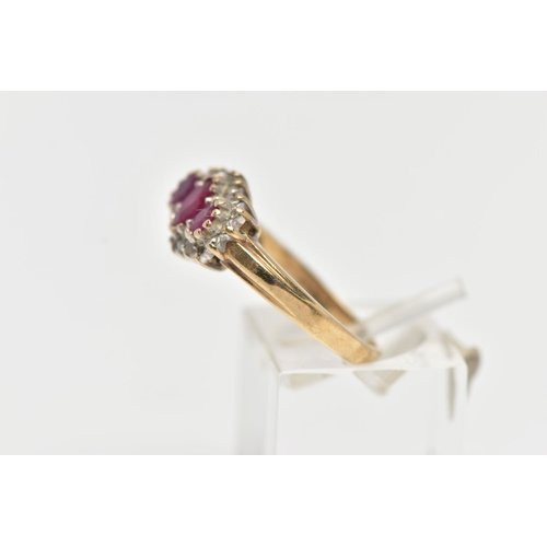26 - A 9CT YELLOW GOLD RUBY AND DIAMOND CLUSTER RING, designed with three graduated oval cut rubies to th... 