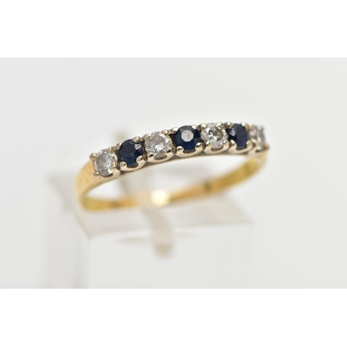 34 - A YELLOW METAL SAPPHIRE AND DIAMOND HALF ETERNITY RING, designed with a row of four claw set, round ... 