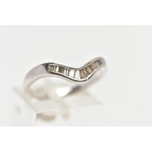 44 - AN 18CT WHITE GOLD DIAMOND WISHBONE RING, half eternity set with tapered baguette cut diamonds, to a... 