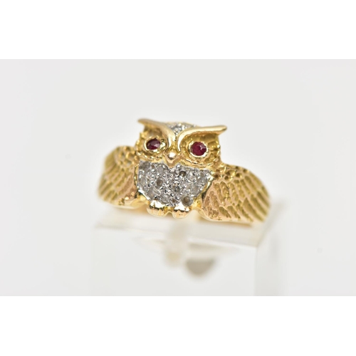 49 - A YELLOW METAL GEM SET RING, in the form of an owl with spread wings, the body is set with single cu... 