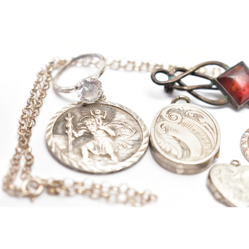 51 - A SMALL BAG OF JEWELLERY, to include two circular St. Christopher pendants, one signed 'Georg Jensen... 