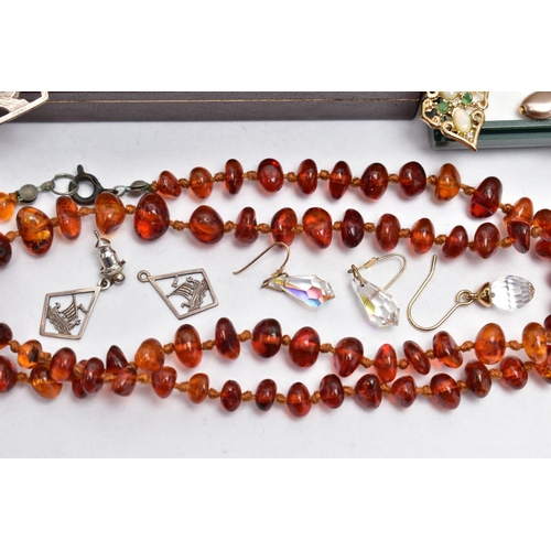 63 - A SELECTION OF JEWELLERY, to include an amber bead bracelet, and necklace, a boxed pair of amber bea... 