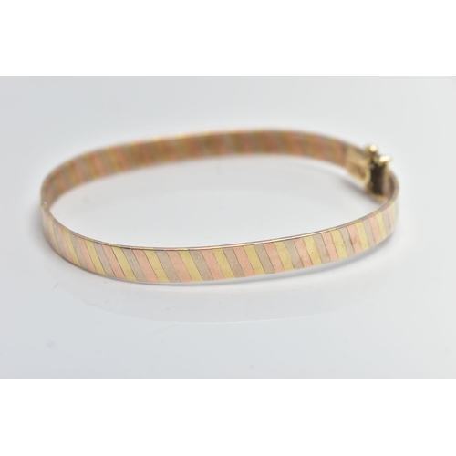70 - A 9CT GOLD TRI COLOUR HINGED BANGLE, bangle width 6.3mm, fitted with an integrated box clasp with tw... 