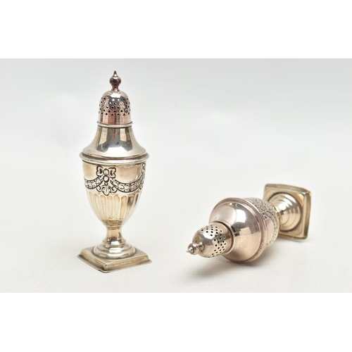 80 - A PAIR OF SILVER PEPPERETTES, each of an urn form, decorated with a bow and swag design with stop re... 